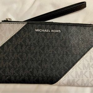 Authentic Michael Kors tri color smartphone wristlet wallet.